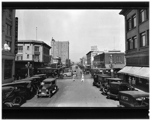 View of parked cars crowding Pine Street at Broadway in Long Beach, ca.1925