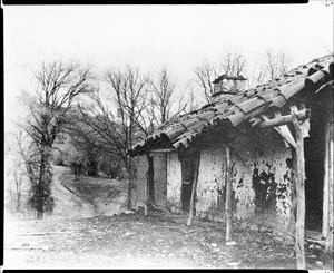 Porch of the adobe house of the gardener at Mission San Antonio, California, ca.1900