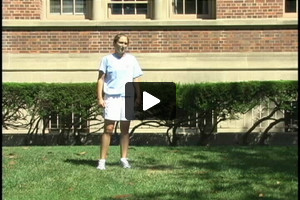 A young female soccer player receiving with right thigh, then passing