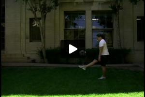 A young female diver juggling, foot bounce foot