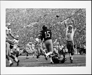 USC quarterback Craig Fertig passing to end Fred Hill in the game against Notre Dame, 1964