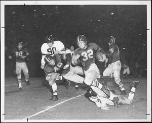 USC player Jim Sears running with the football in the game against Northwestern, 1952