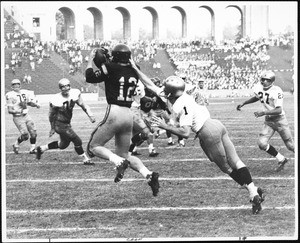 USC Receiver Rod Sherman catching the football in mid-air, 1964