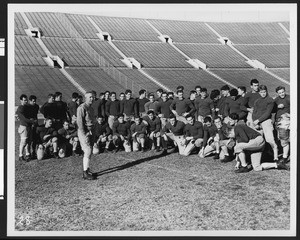 University of Southern California football coach Howard Jones, opening day of football practice 1938, speaking to entire football team in LA Coliseum