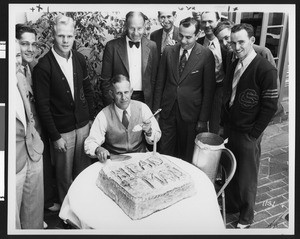 University of Southern California football coach Howard Jones gets a birthday cake decorated with his nickname "Head Man" in 1933, location unknown