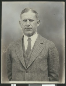 University of Southern California football coach Howard Jones, in pinstriped suit, waist up, 1925