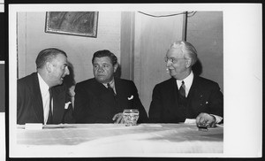 University of Southern California football coach Sam Barry, baseball player Babe Ruth, and USC President Rufus B. von KleinSmid at a dinner, location unknown, circa 1941