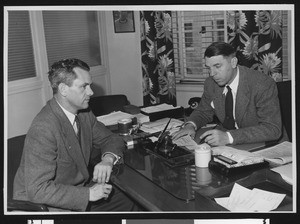 University of Southern California coach Jess Hill (left) and alumni review editor Arnold Eddy, USC campus, 1947