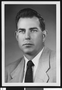 University of Southern California assistant football coach Bill Fisk, studio shot in dark tie and light jacket, 1951