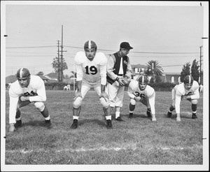 USC football coach Jess Hill with players Al Carmichael, Dean Schneider, Pat Duff and Frank Gifford, 1951