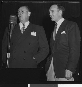 University of Southern California head football coach Jeff Cravath with telecaster Tom Harmor, student homecoming rally, 1949