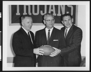 University of Southern California athletic director Jess Hill, John McKay, and Don Clark at the press conference for Don Clark's resignation and John McKay's succession as football coach, USC campus, 1959