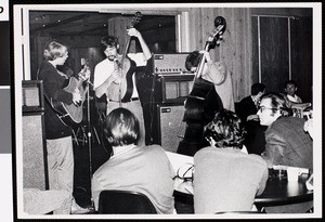 Band performing in front of a group of spectators