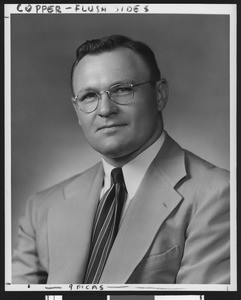 University of Southern California assistant football coach Harry Smith, studio shot in striped tie and light jacket, 1949