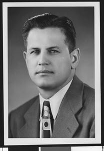 University of Southern California assistant football coach Joseph Muha, studio shot in geometric patterned tie and earth-toned jacket, 1951