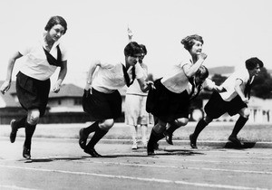 Five women runners just taking off from the starting line, Bovard Field track, USC, ca. 1920-1929