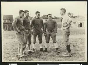 University of Southern California football coach Howard Jones with four players from the 1925 varsity squad, Bovard Field, USC campus, 1925