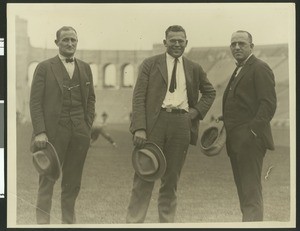 University of Southern California football coaches Bill Hunter, John Thurman, and "Gloomy Gus" Henderson at Los Angeles Coliseum, ca. 1923