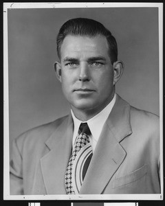 University of Southern California assistant football coach Bill Fisk, studio shot in geometic patterned tie and light jacket, 1954