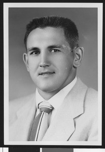 University of Southern California football line coach Don Clark, studio shot in light jacket, 1951