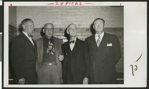 Four coaches for University of Southern California football, years 1888 through 1950, at a football banquet, Los Angeles, 1950