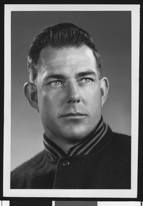 University of Southern California assistant football coach Bill Fisk, studio shot in letter jacket, 1951