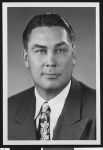 University of Southern California assistant football coach Mel Hein, studio shot in flowered tie and dark jacket, 1951