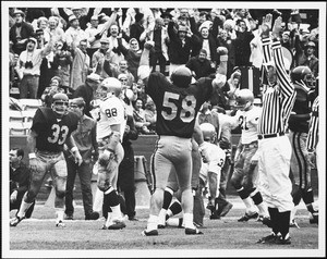 Football players and spectators at a USC game