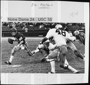 USC player holding the football in the comeback game against University of Notre Dame, 1974