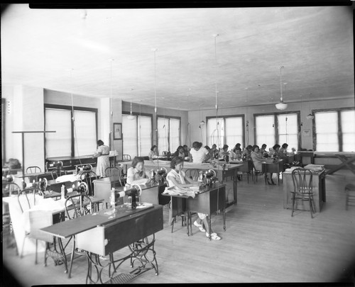Students sewing in classroom