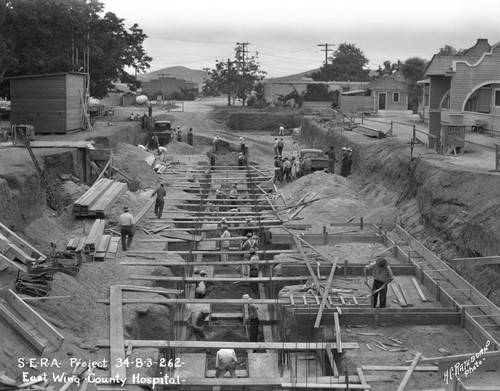 Construction workers constructing building