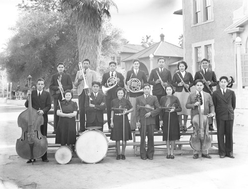 Student musicians pose with their instruments