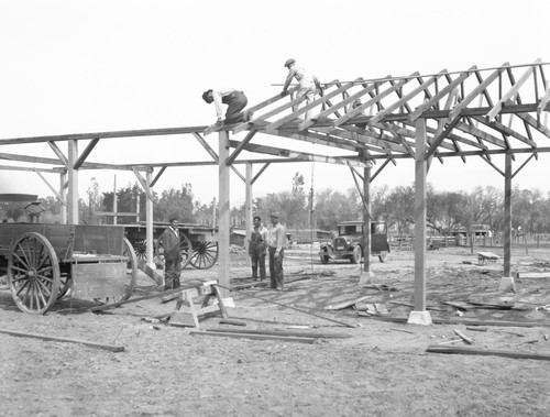 Students building structure on school farm