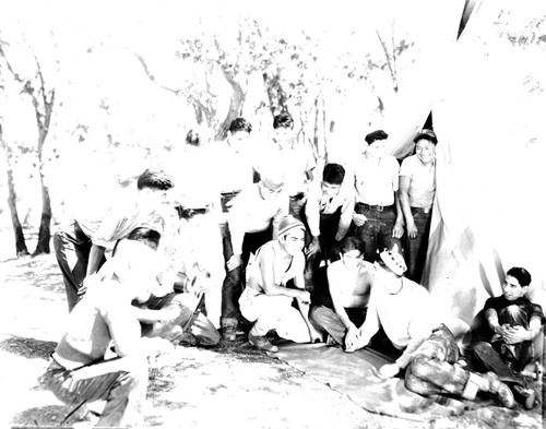 Students posing for photograph outside tent