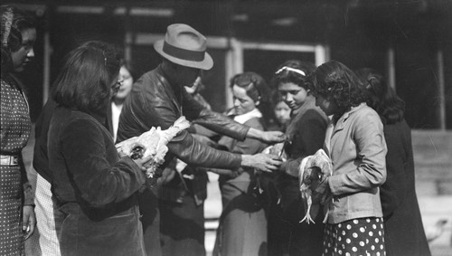 Students holding chickens