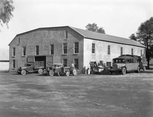 Students attending to various automobiles