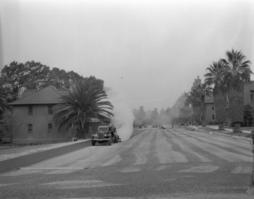 Roadworkers repave street on Sherman campus