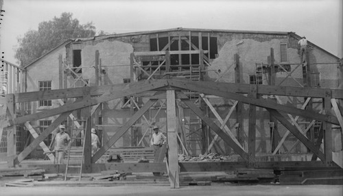 Students working on construction of building