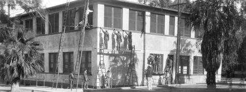 Students painting building