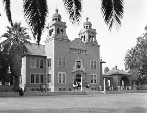 Students go to class in main school building