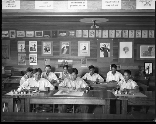 Students painting in classroom