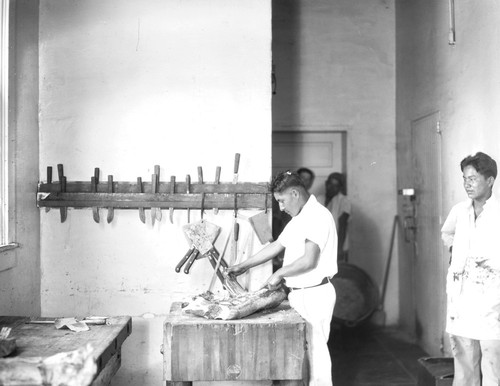 Student practices butchering meat