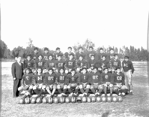 Sherman football team with faculty member