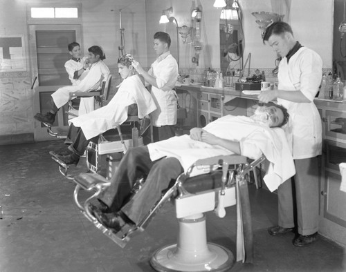 Students working in barbershop