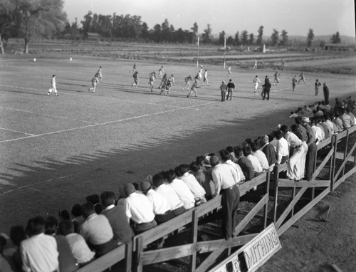 N audience watching football game