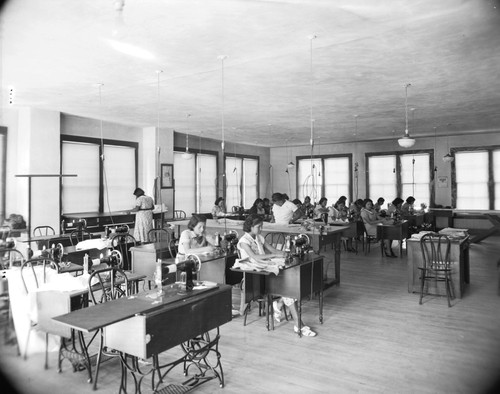 Students sewing in class