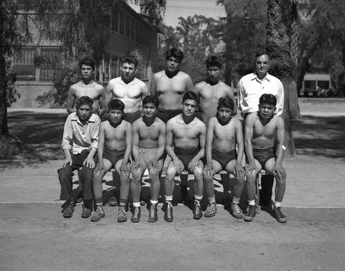 Group portrait of student athletes with coach