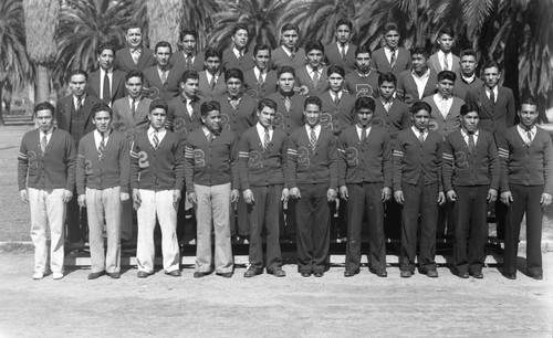 Group portrait of students in lettermen cardigans