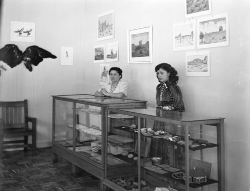 Women working at arts and crafts exhibit