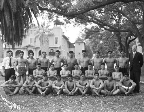 Group portrait of student athletes with coach